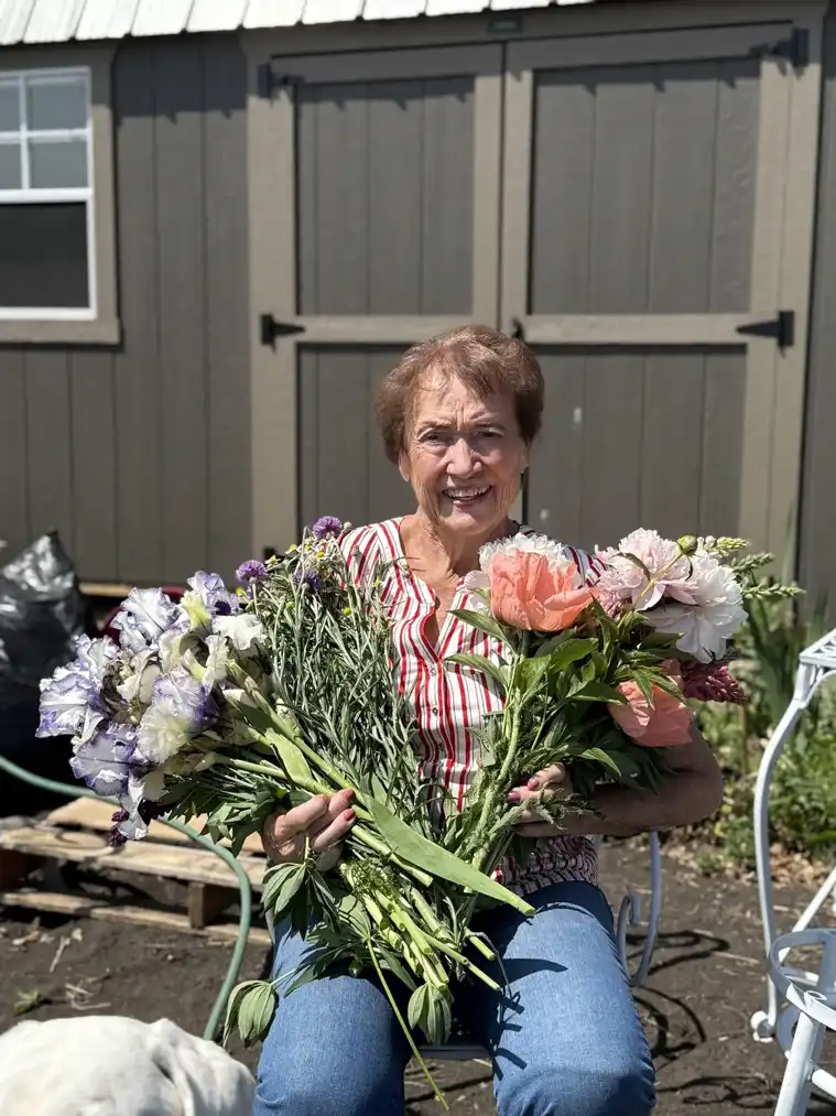 An armful of freshly gathered pink and white flowers at BG Bouquet Garden